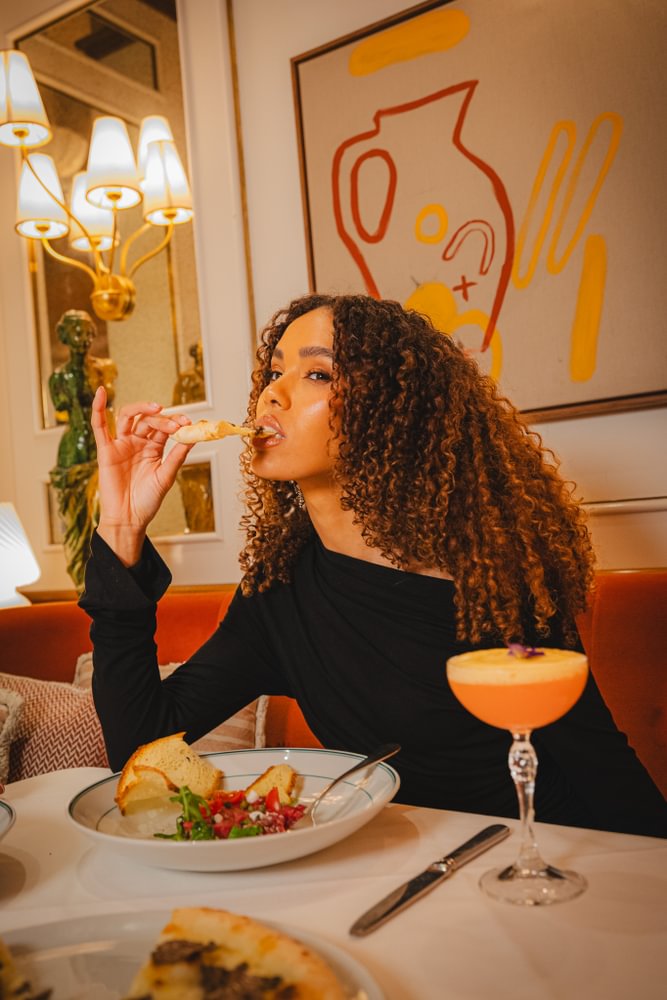 Italian dining at San Carlo Liverpool, woman enjoying her meal.